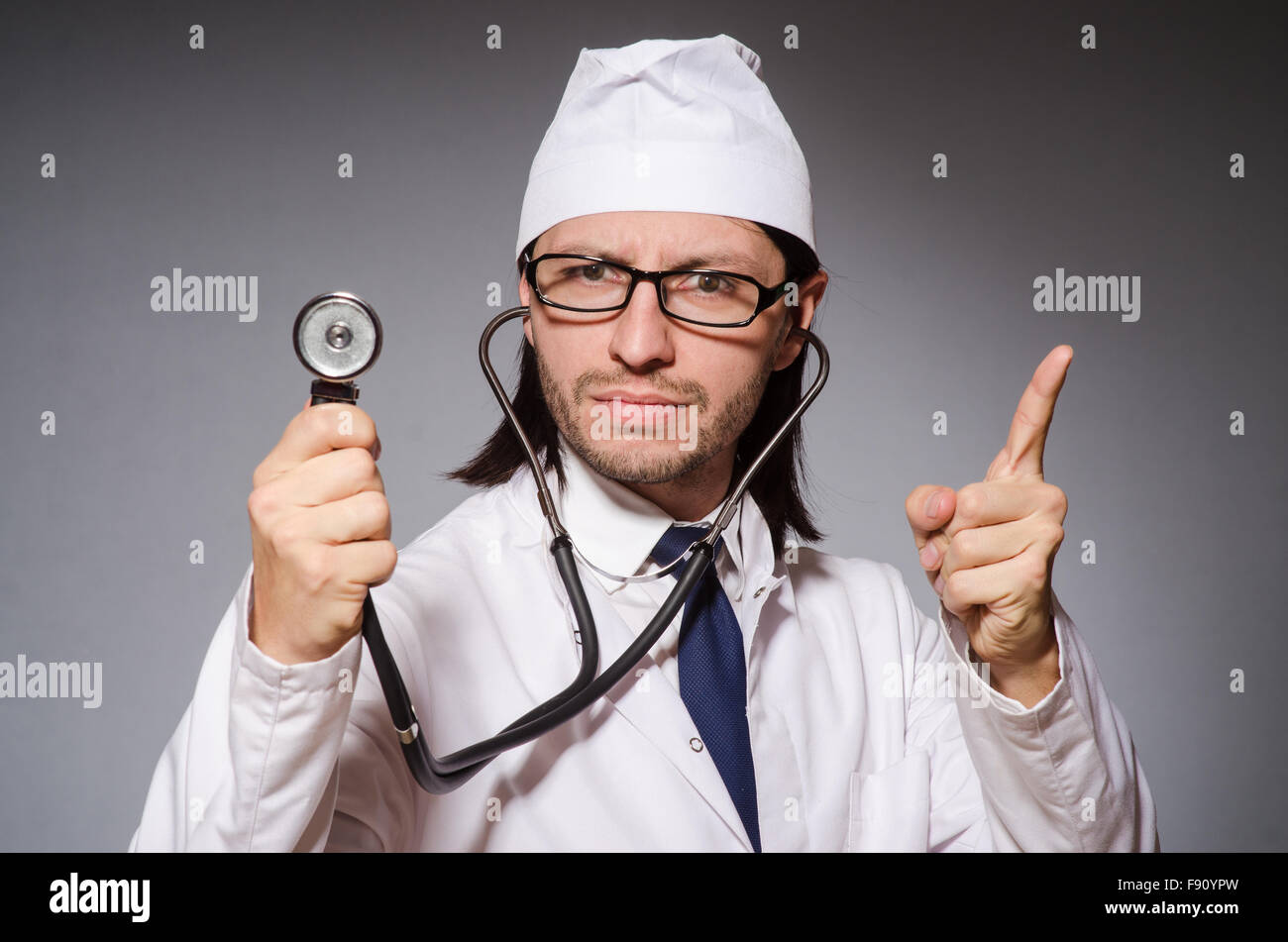 Young doctor with stethoscope in medical concept Stock Photo - Alamy