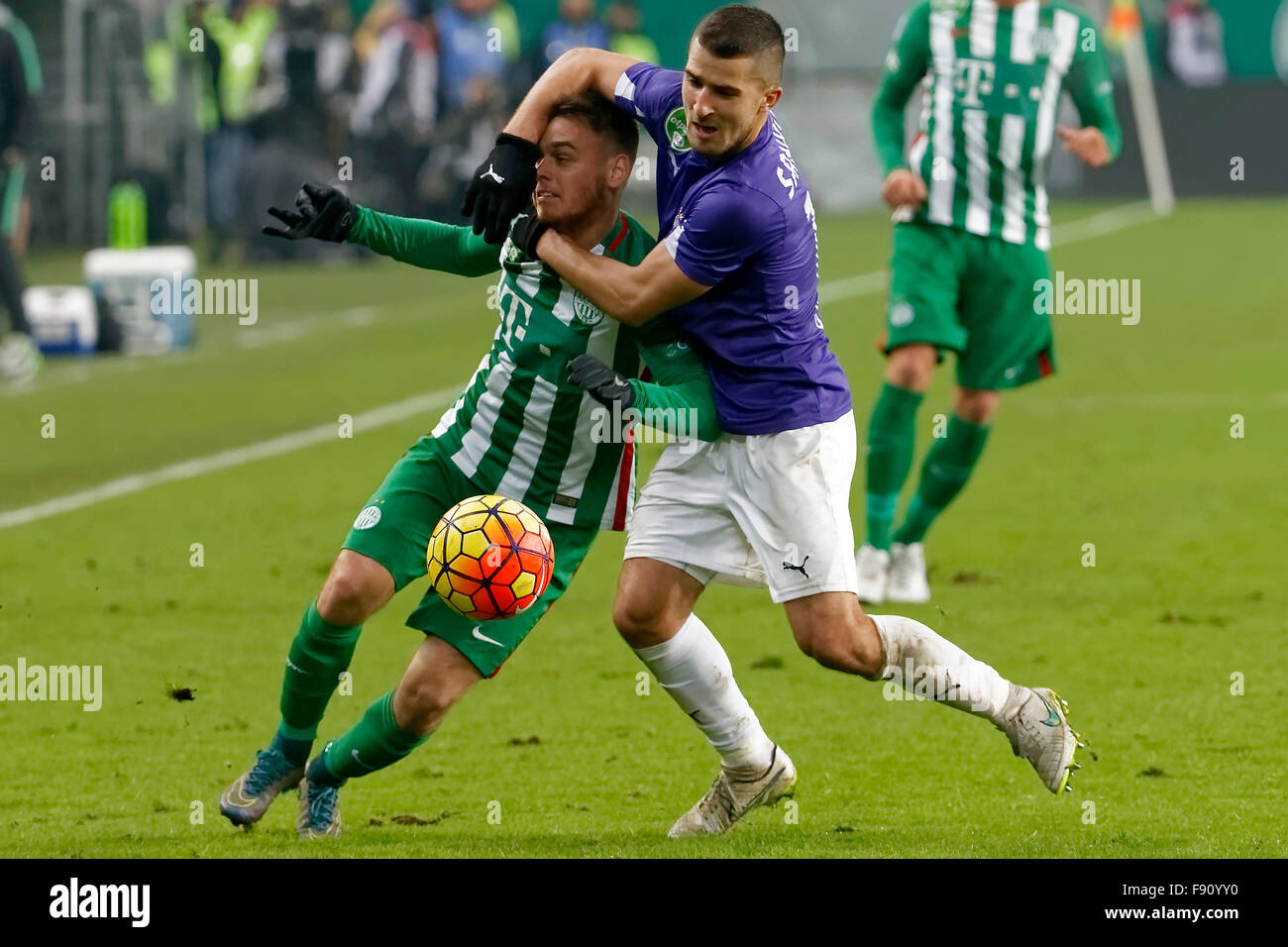 (r-l) Isael da Silva Barbosa of Ferencvarosi TC challenges Dzenan