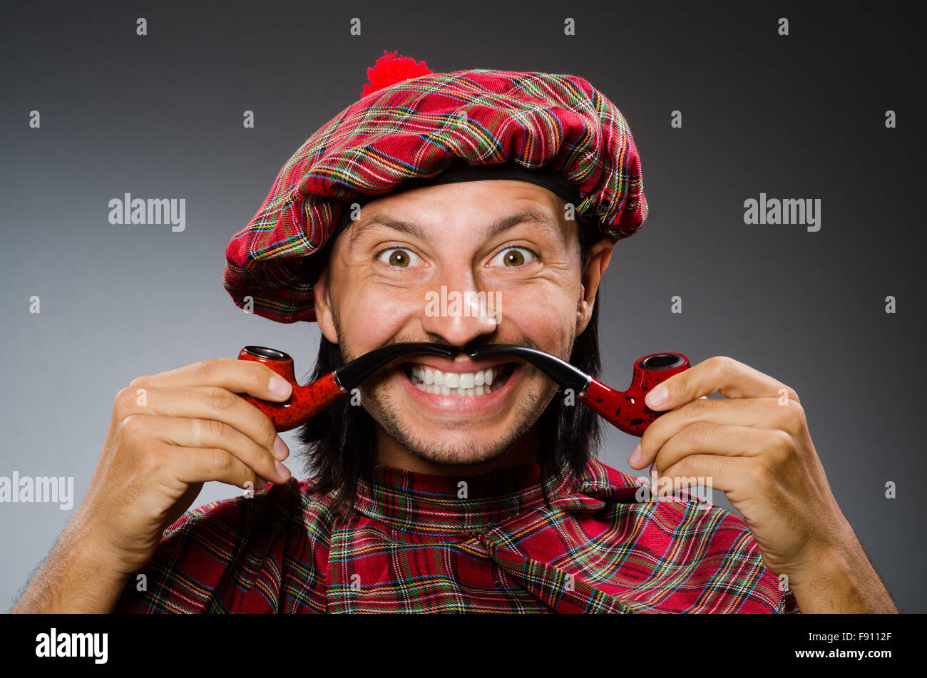 Funny scotsman with smoking pipe Stock Photo Alamy
