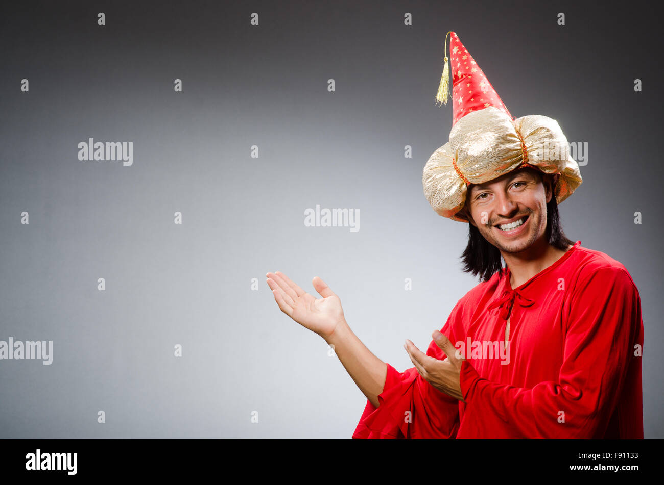 Funny wizard wearing red dress Stock Photo - Alamy