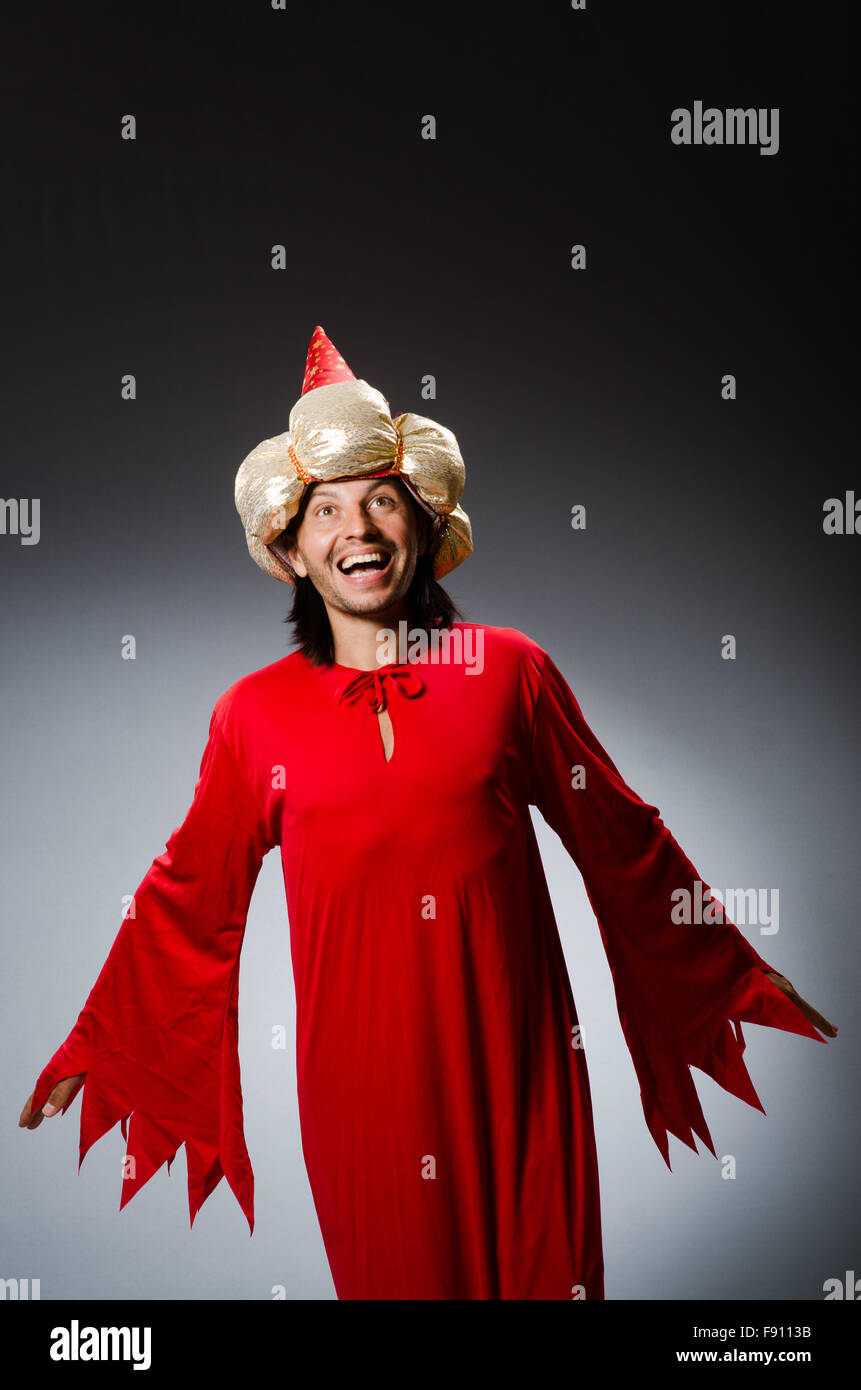 Funny wizard wearing red dress Stock Photo - Alamy