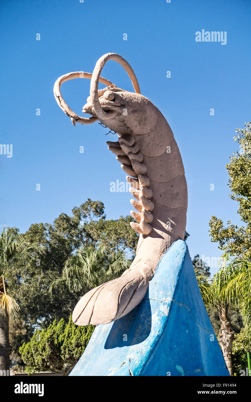comically oversize statue of painted plaster shrimp ensconced on crest of wave dominates Plaza del Camarenero  Puerto Penasco Stock Photo