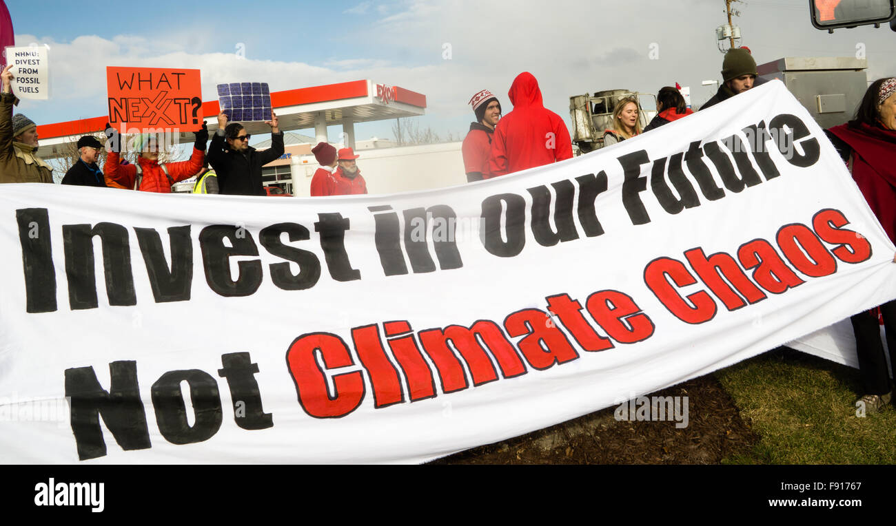 Murray, Utah, USA, 12th December, 2015. Environmental Activists blockade an Exxon gas station in Murray to raise awareness of the companies false statements regarding the seriousness of climate change. Brent Olson / Alamy Live News. Stock Photo
