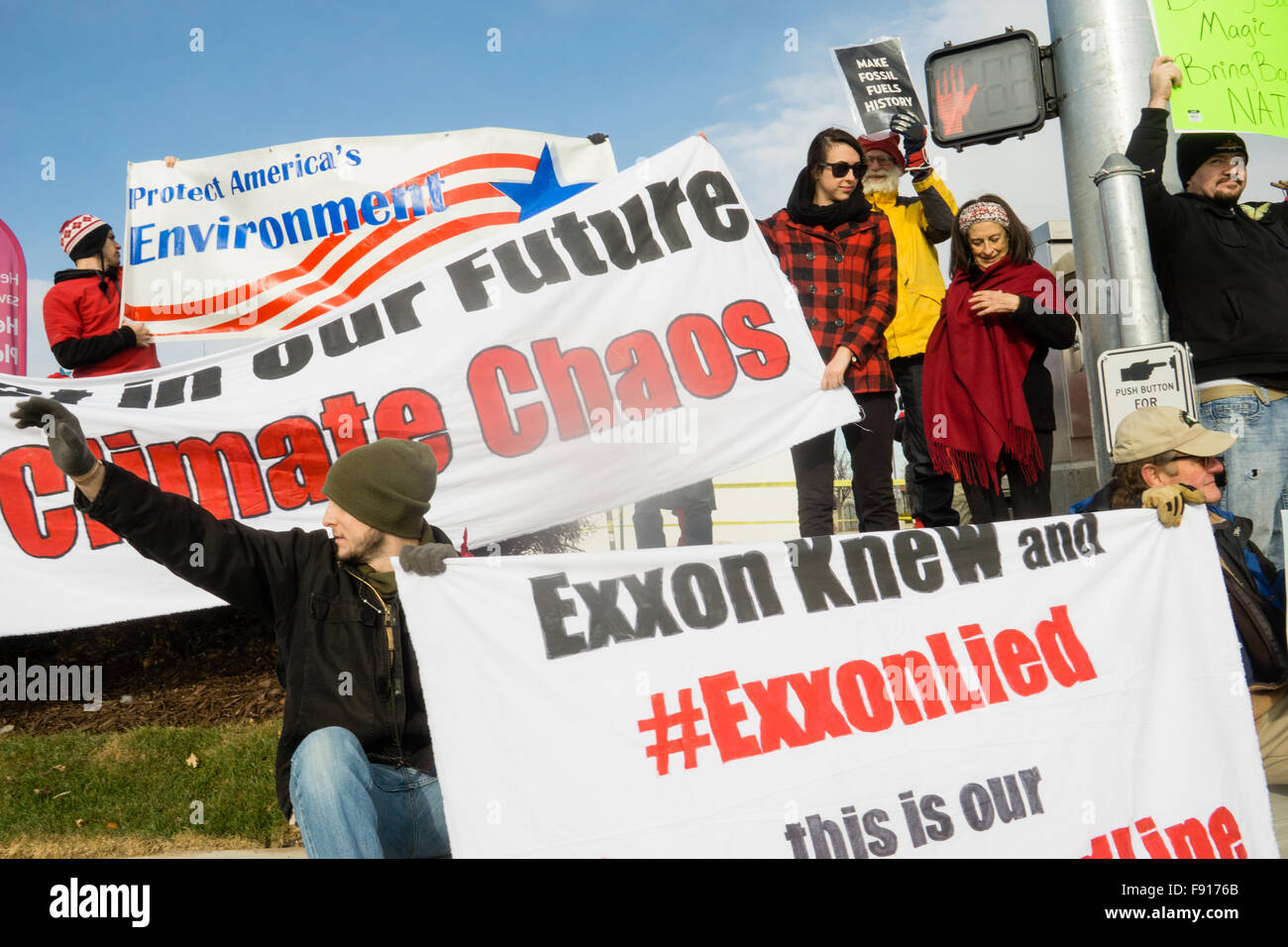 Murray, Utah, USA, 12th December, 2015. Environmental Activists blockade an Exxon gas station in Murray to raise awareness of the companies false statements regarding the seriousness of climate change. Brent Olson / Alamy Live News. Stock Photo