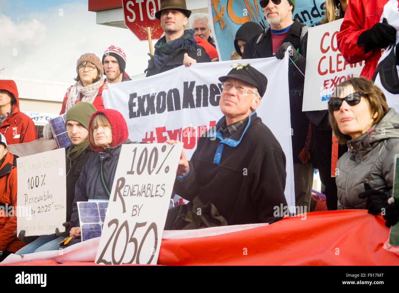 Murray, Utah, USA, 12th December, 2015. Environmental Activists blockade an Exxon gas station in Murray to raise awareness of the companies false statements regarding the seriousness of climate change. Brent Olson / Alamy Live News. Stock Photo