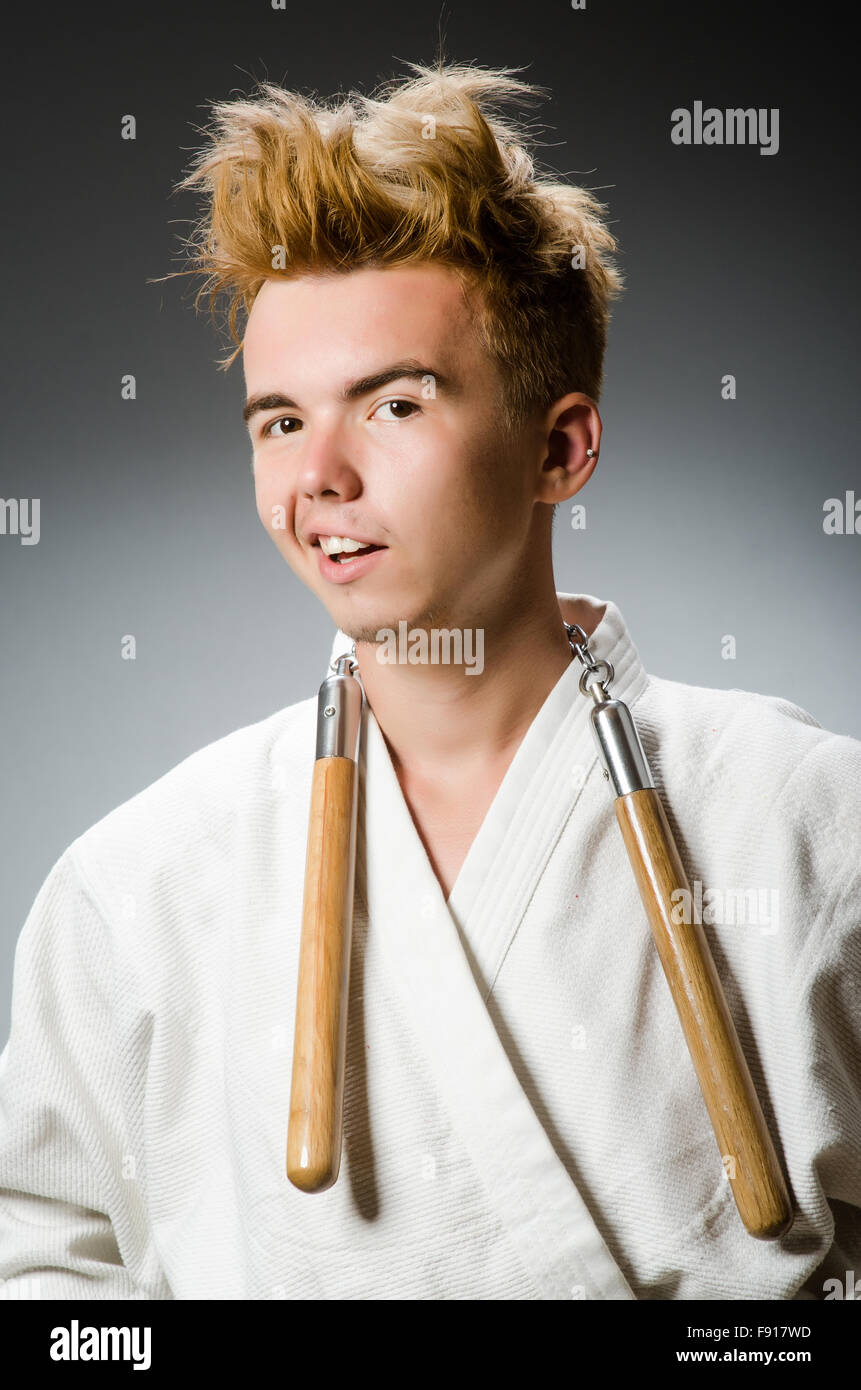Funny karate fighter with nunchucks Stock Photo Alamy