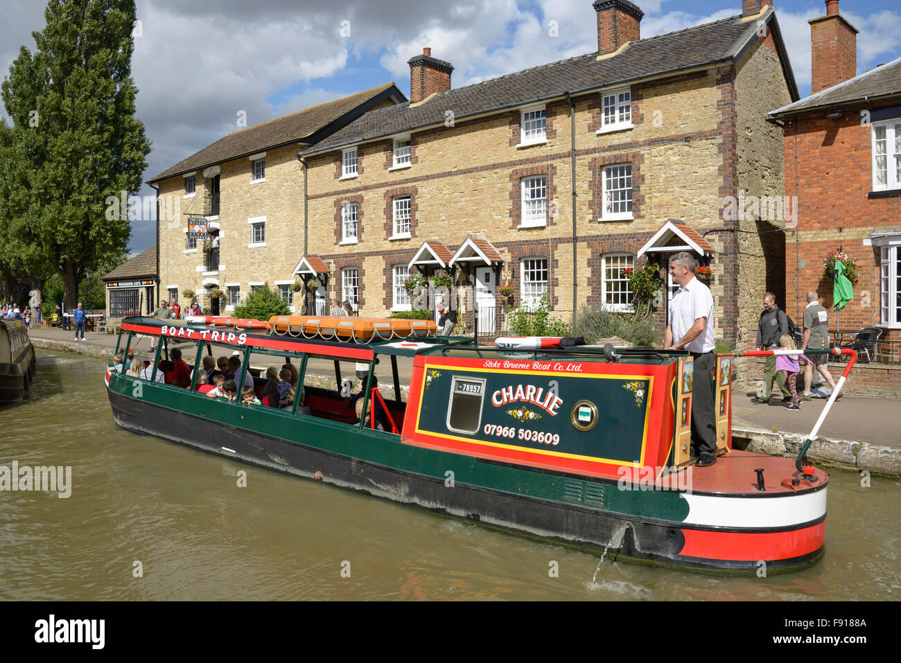 Cruise canal boat on Grand Union Canal, Stoke Bruerne, Northamptonshire, England, United Kingdom Stock Photo