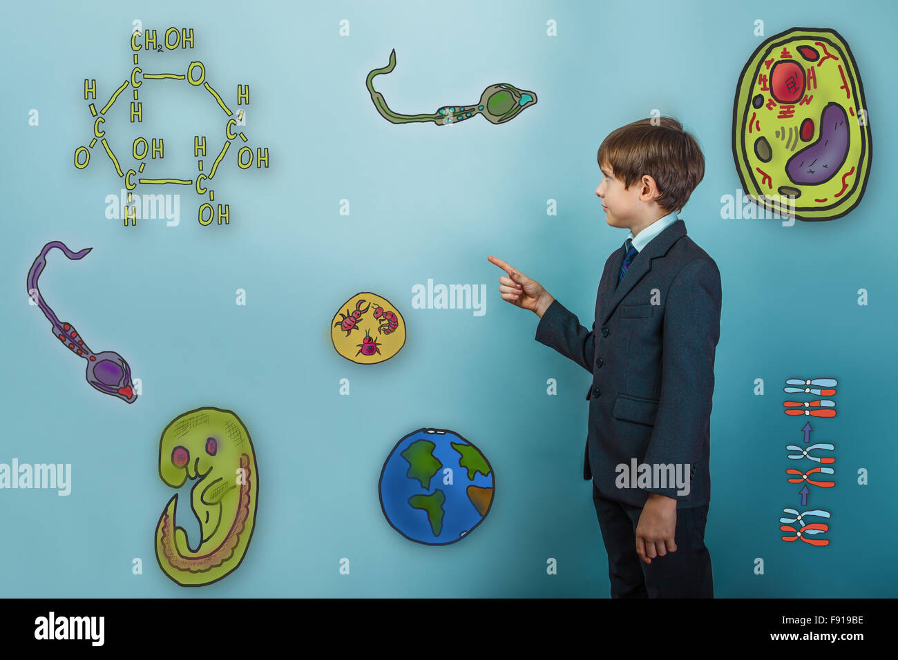 Teen boy businessman turned sideways and points a finger at Icon Stock