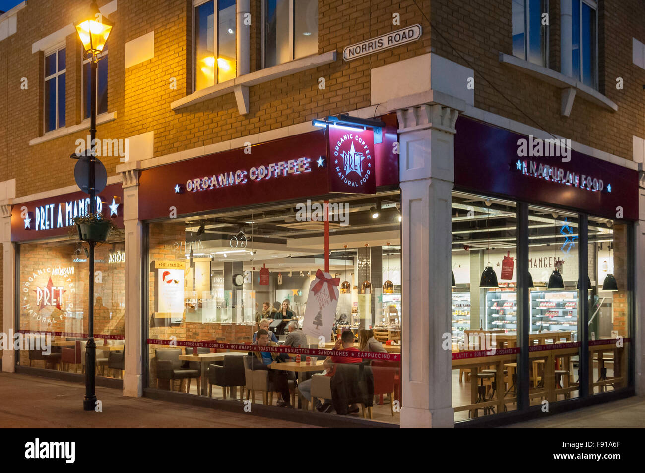 Pret a Manger restaurant at dusk, High Street, Staines-upon-Thames, Surrey, England, United Kingdom Stock Photo
