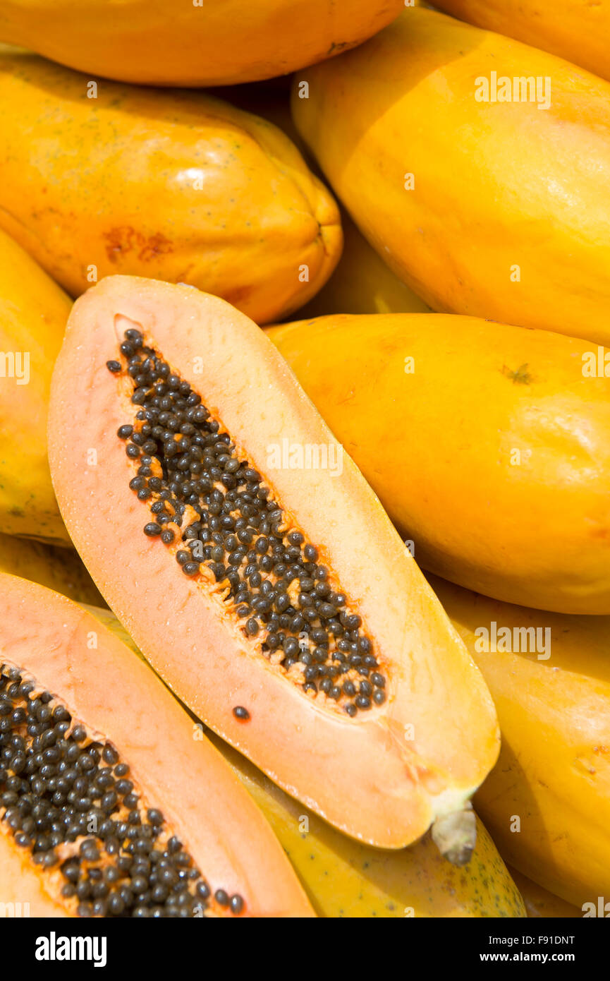 Fresh cut juicy tropical papaya mamao fruit with seeds at Brazilian