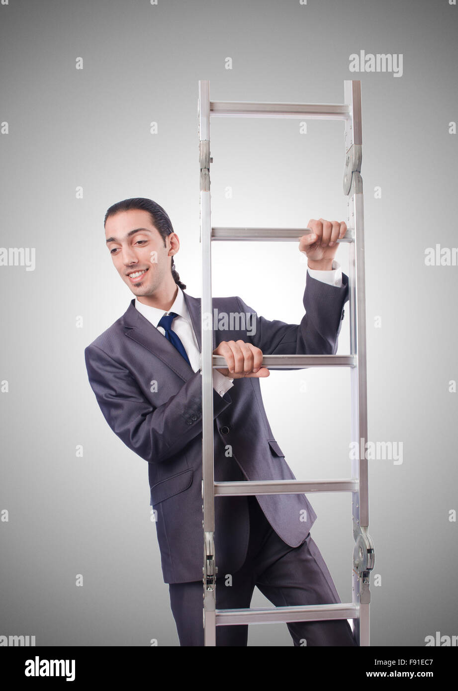 Businessman climbing the ladder against the gradient Stock Photo - Alamy