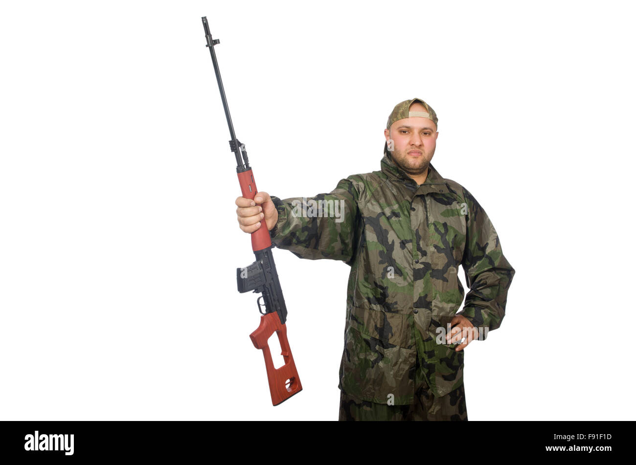 Young man in soldier uniform holding gun isolated on white Stock Photo ...