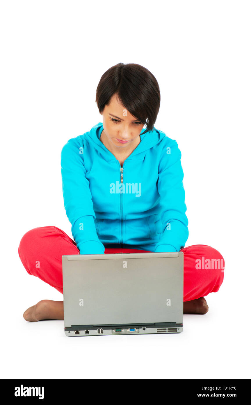 Young girl working on laptop isolated on white Stock Photo - Alamy