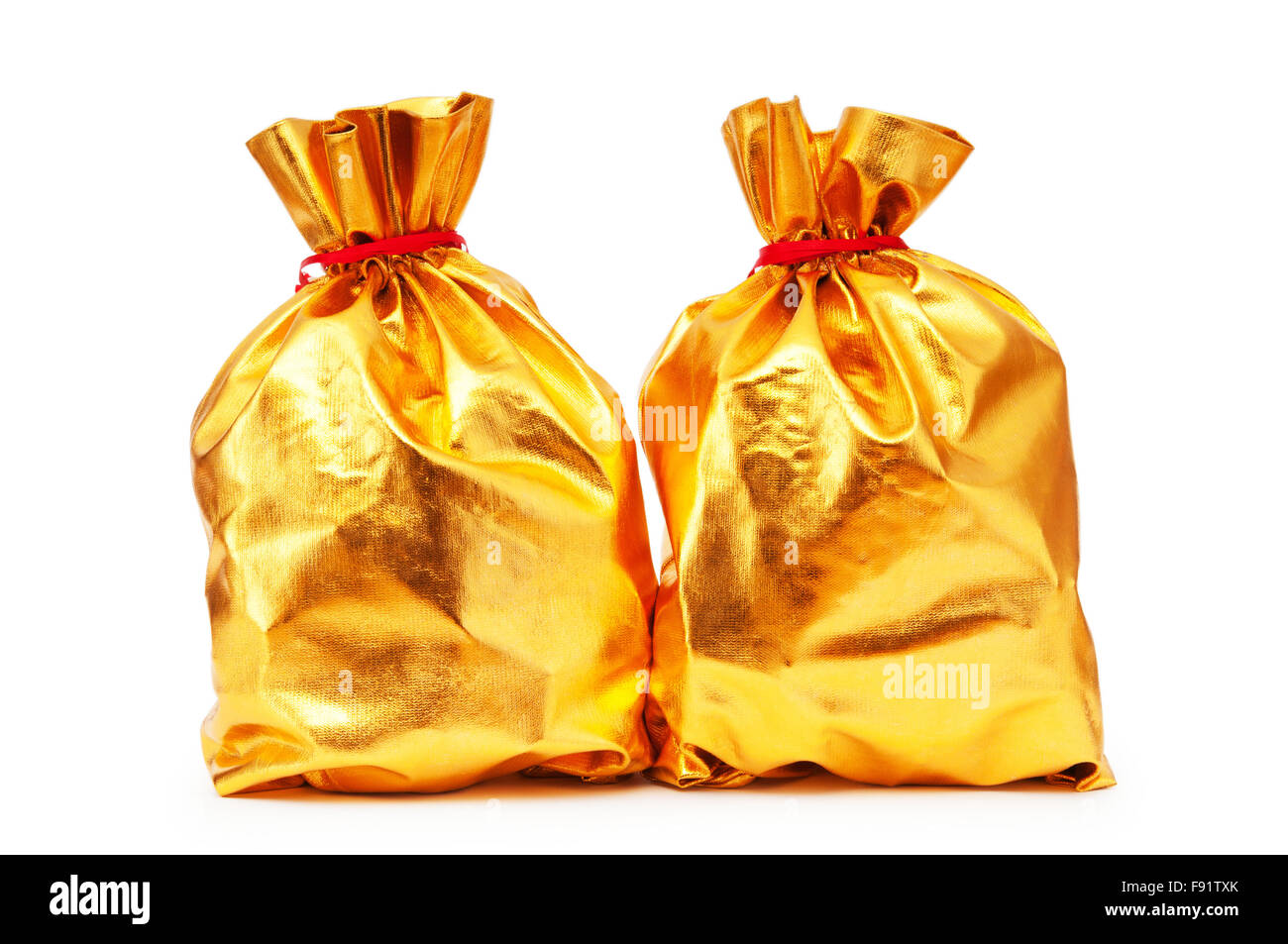 Golden sacks full of something good Stock Photo Alamy