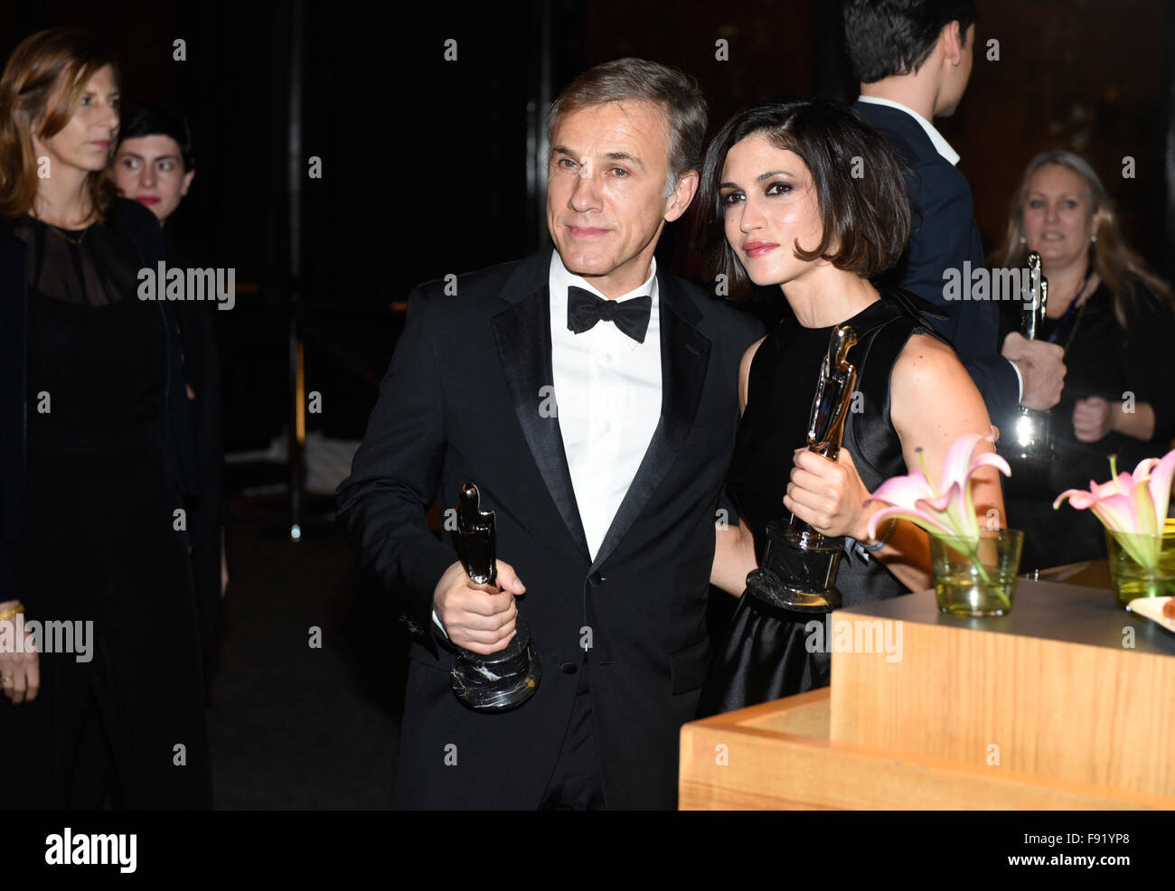 Christoph Waltz and Nerea Barros showing the awards during the 28th European Film Award ceremony in Berlin, Germany, late 12 December 2015. Photo: Clemens Bilan/dpa Stock Photo