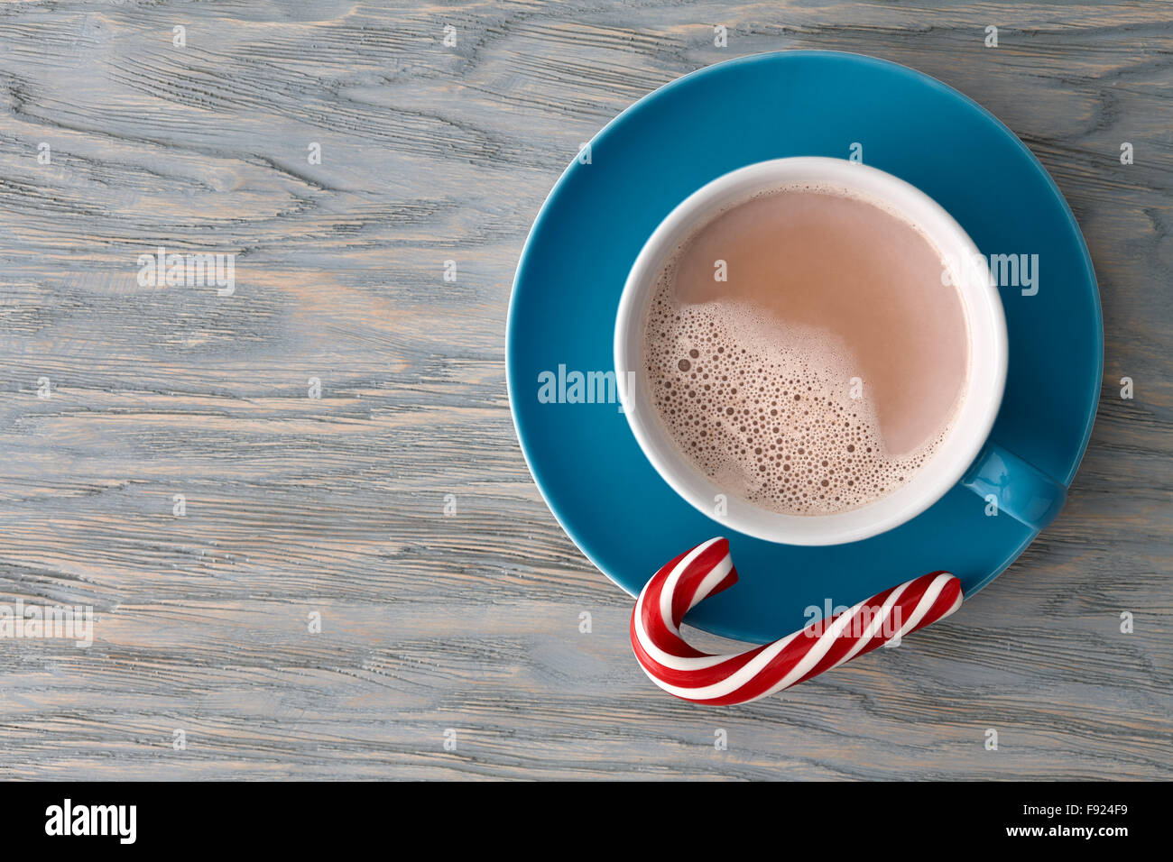 Cocoa cup with a striped candy cane Stock Photo