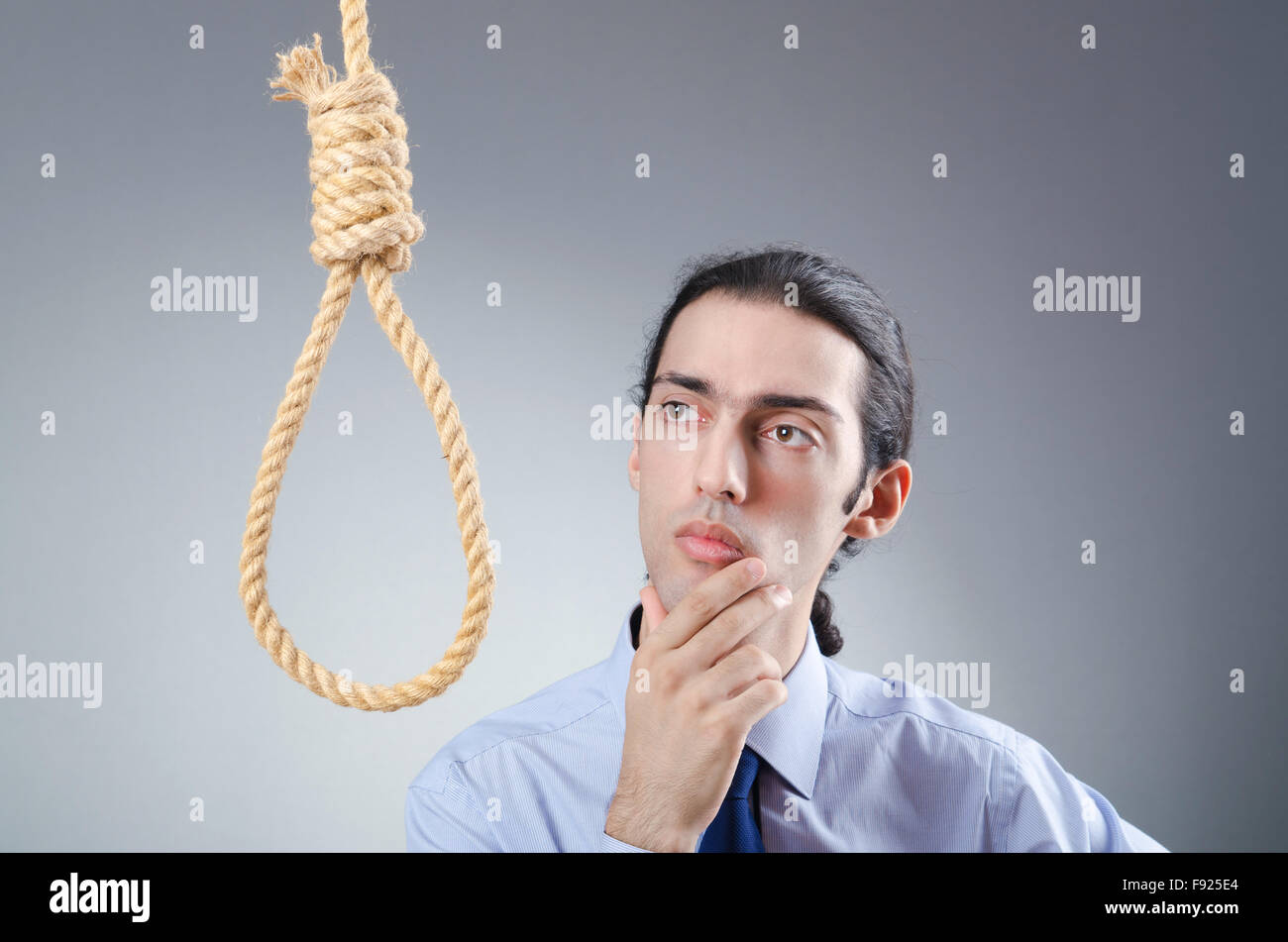 businessman-committing-suicide-through-hanging-F925E4.jpg