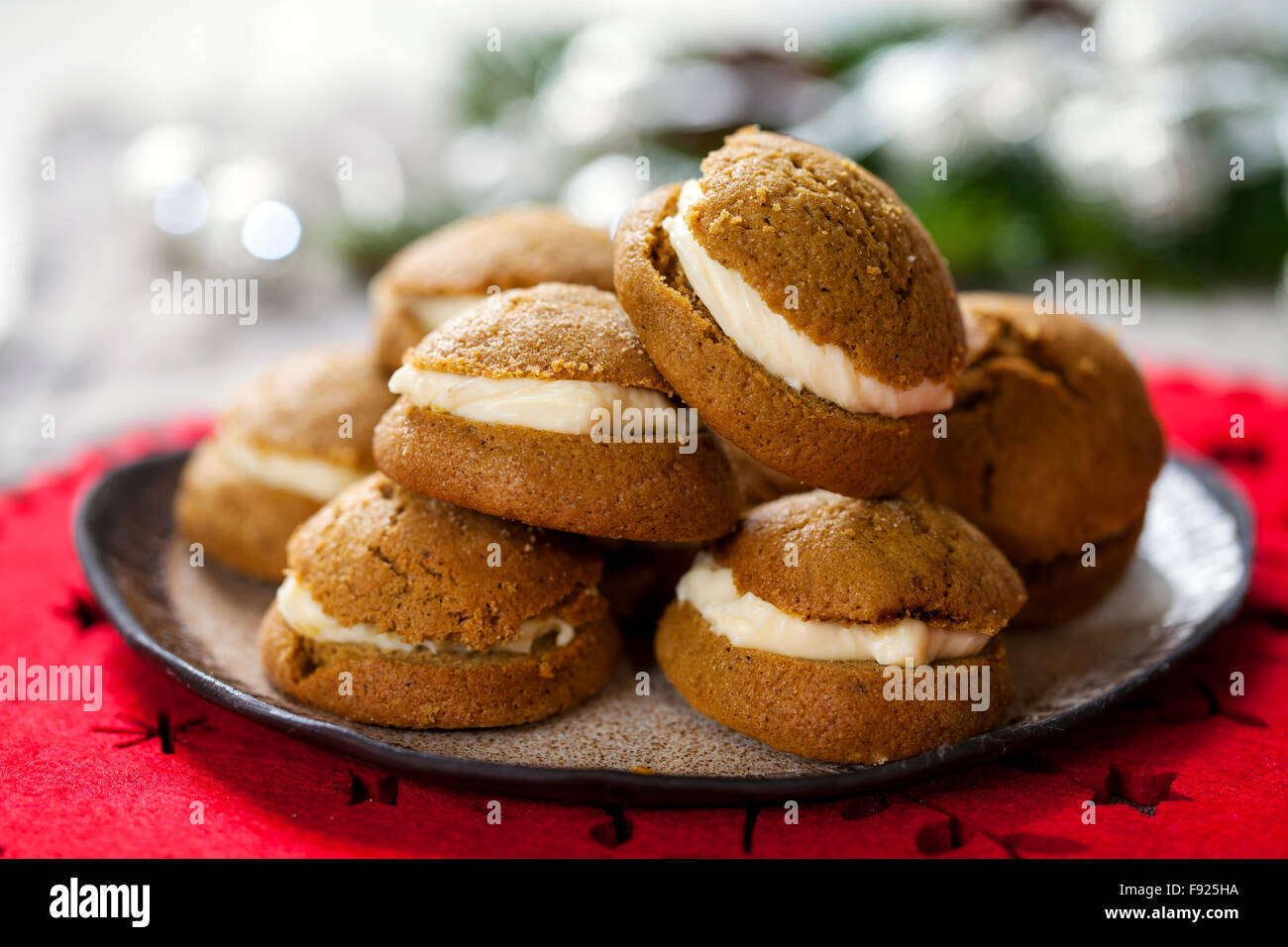 Ginger cookies filled with mascarpone and lemon curd cream Stock Photo
