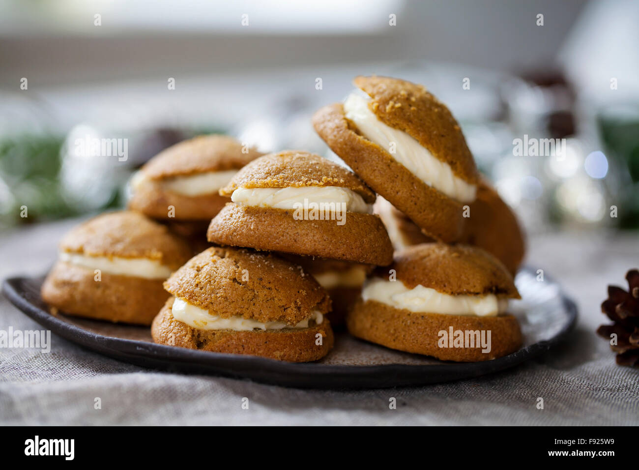 Ginger cookies filled with mascarpone and lemon curd cream Stock Photo