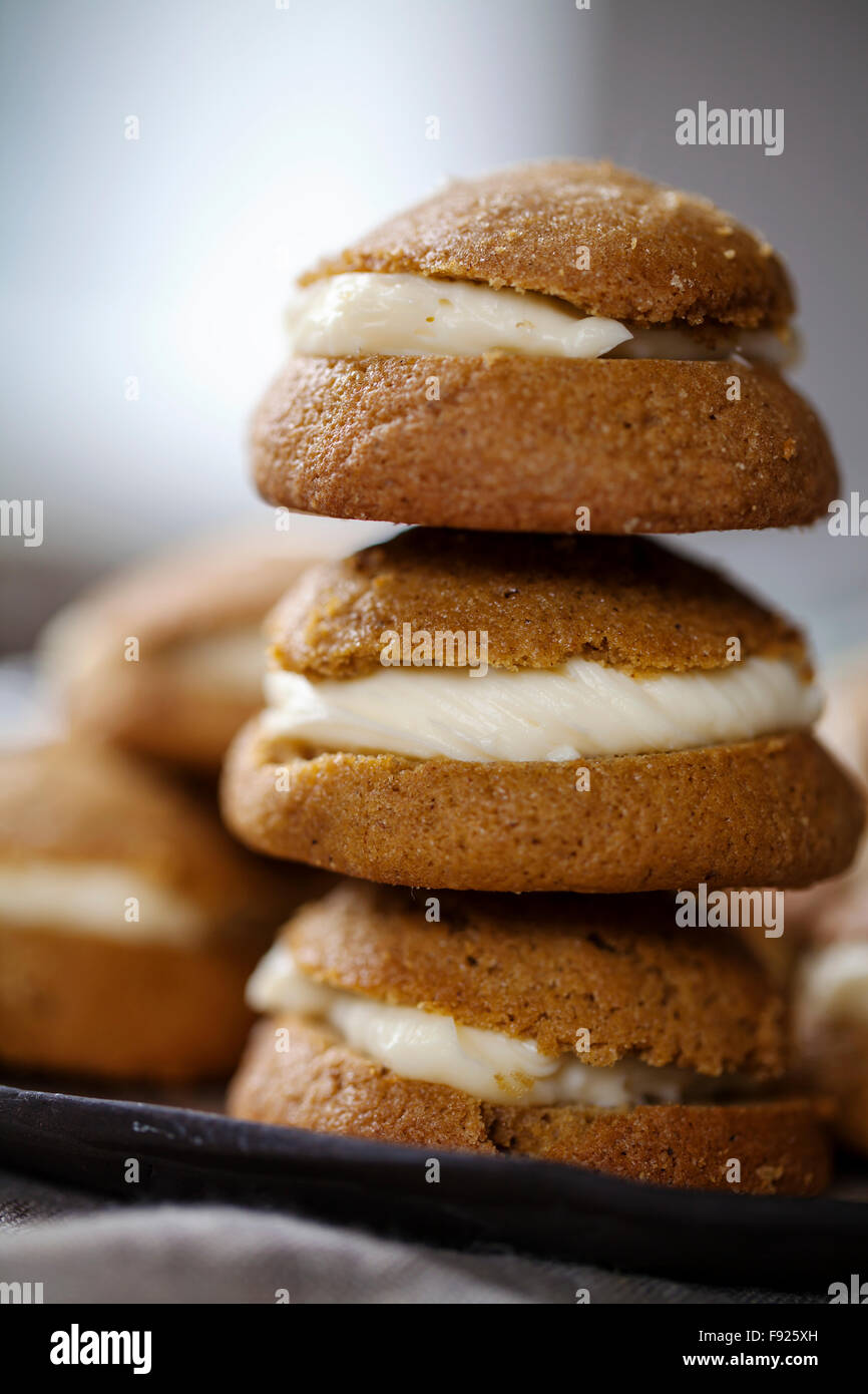 Ginger cookies filled with mascarpone and lemon curd cream Stock Photo