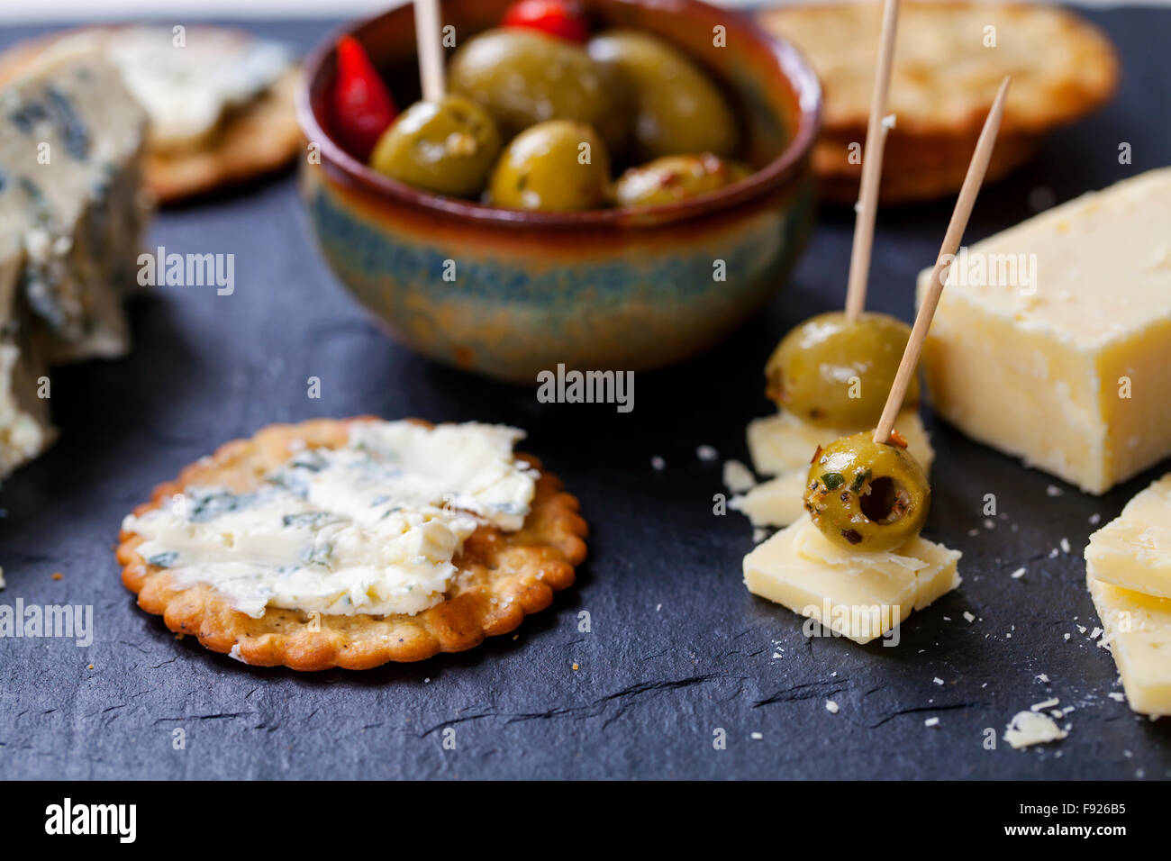 Olives, cheese and biscuits Stock Photo