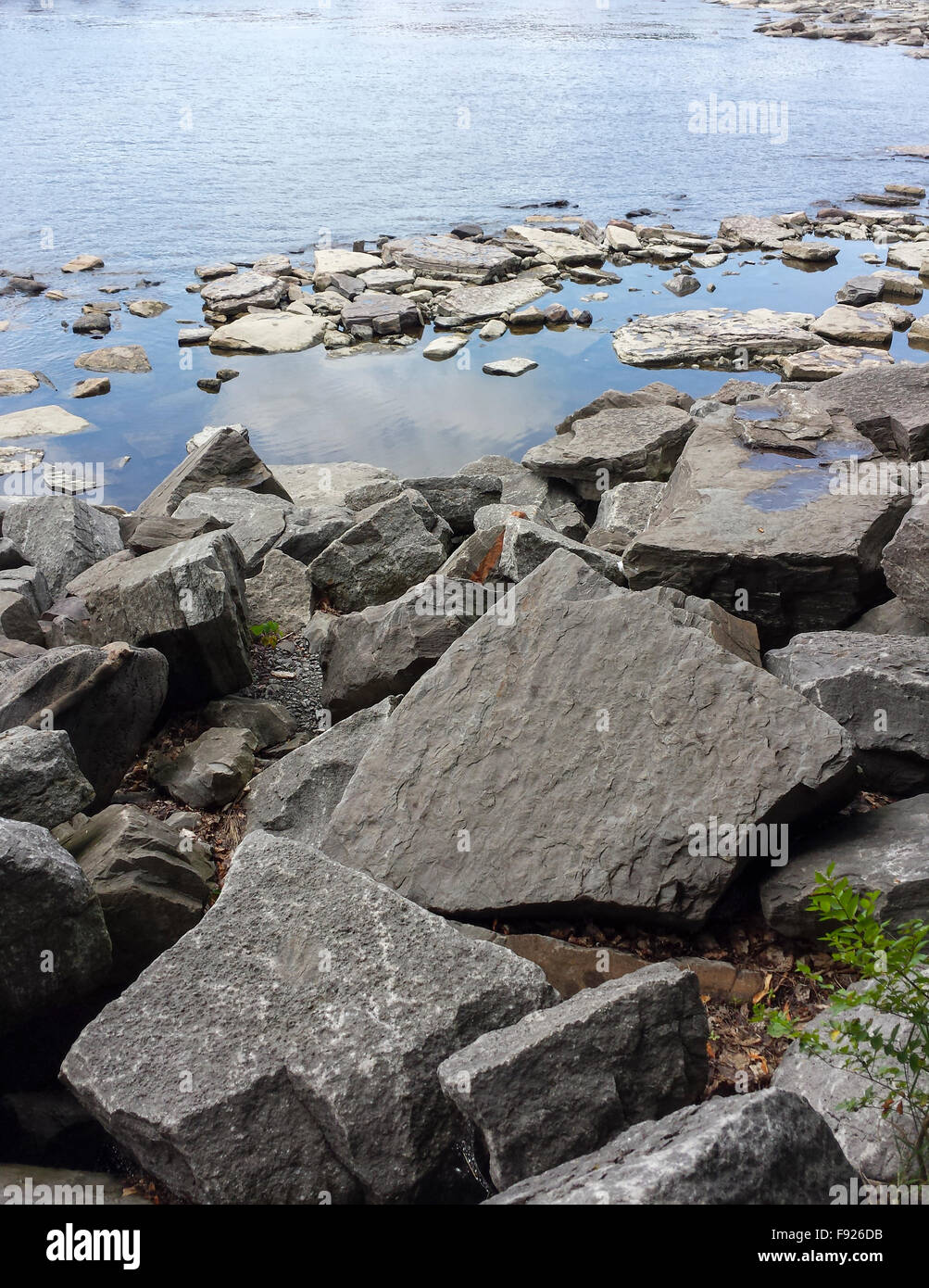 Rocks on water Stock Photo - Alamy