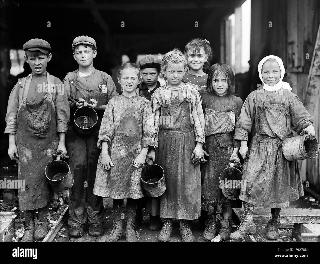 LEWIS HINE (1874-1940) American sociologist and photographer. His photo of child oyster shuckers at the Maggioni Canning factory in  Port Royal, South Carolina, in February 1912. He noted that  the youngest were eight years old and that they worked at the factory before and after school. Stock Photo