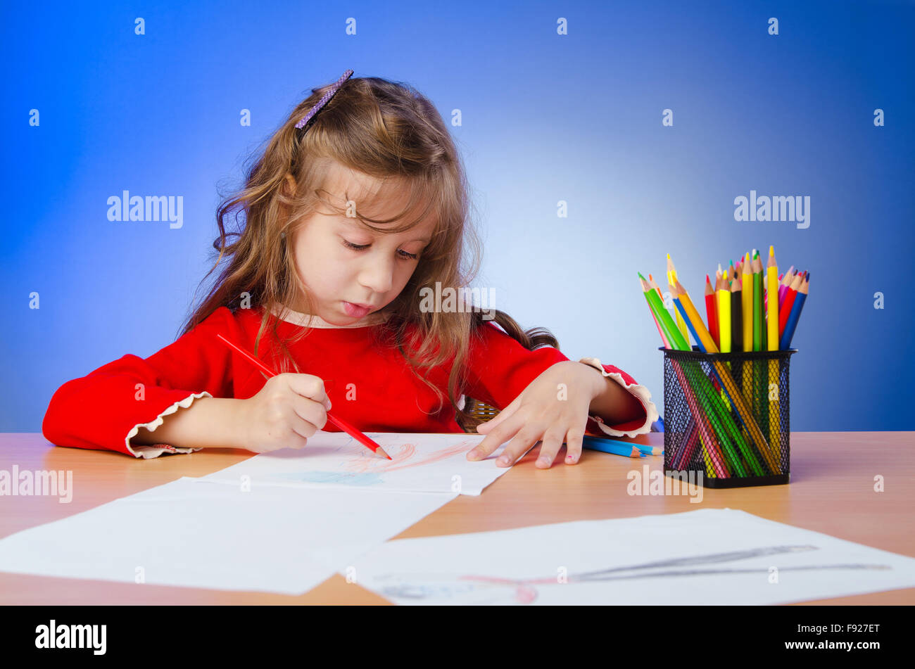 Little girl drawing with pencils Stock Photo - Alamy