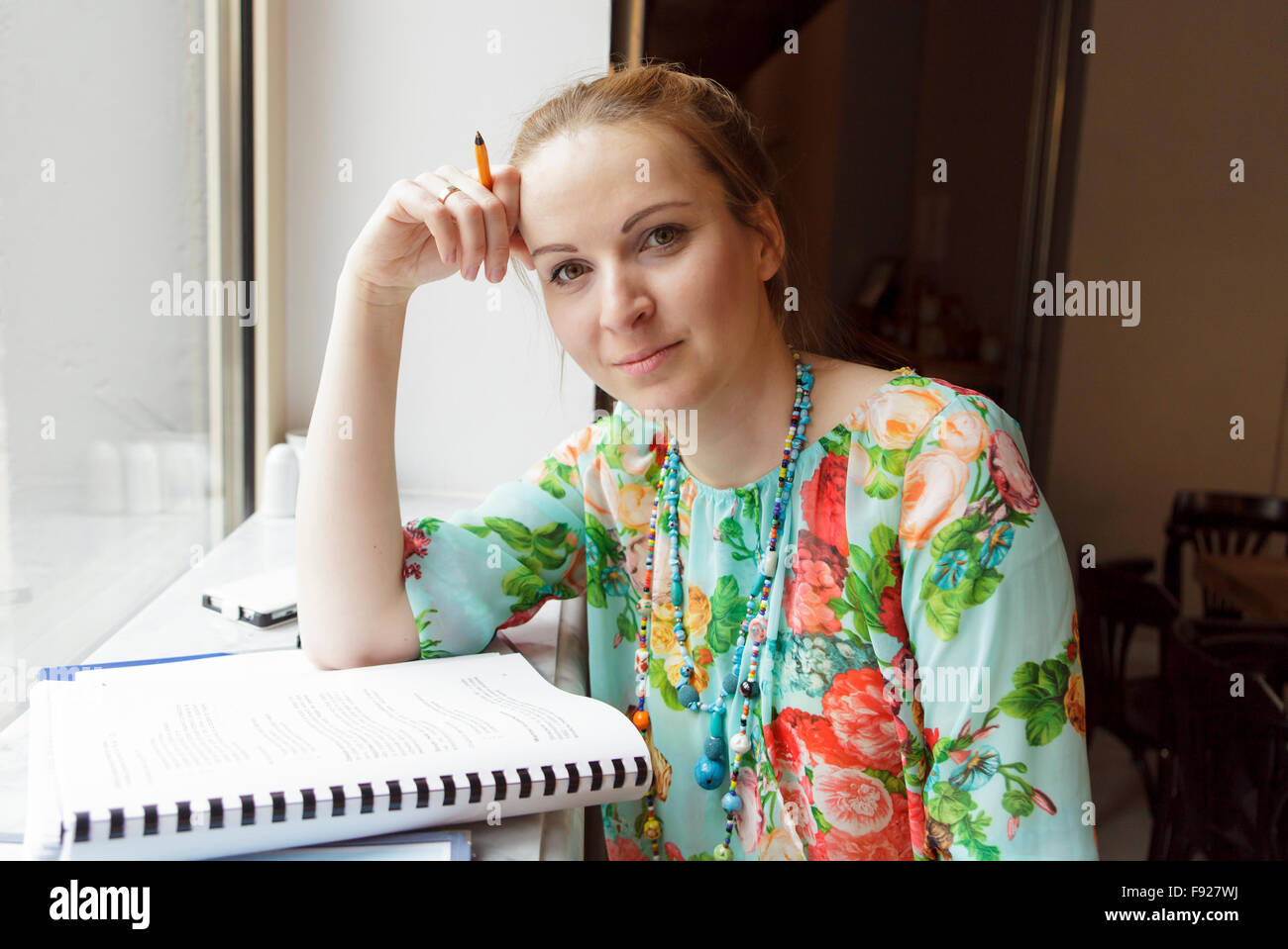 Young woman studying in the cafe Stock Photo