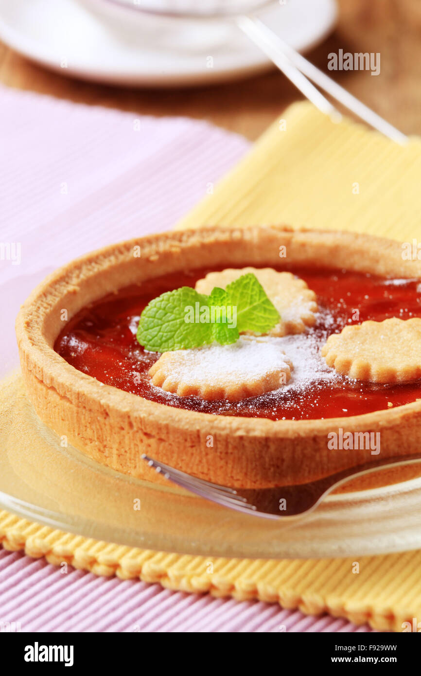 Homemade jam tart sprinkled with sugar - closeup Stock Photo