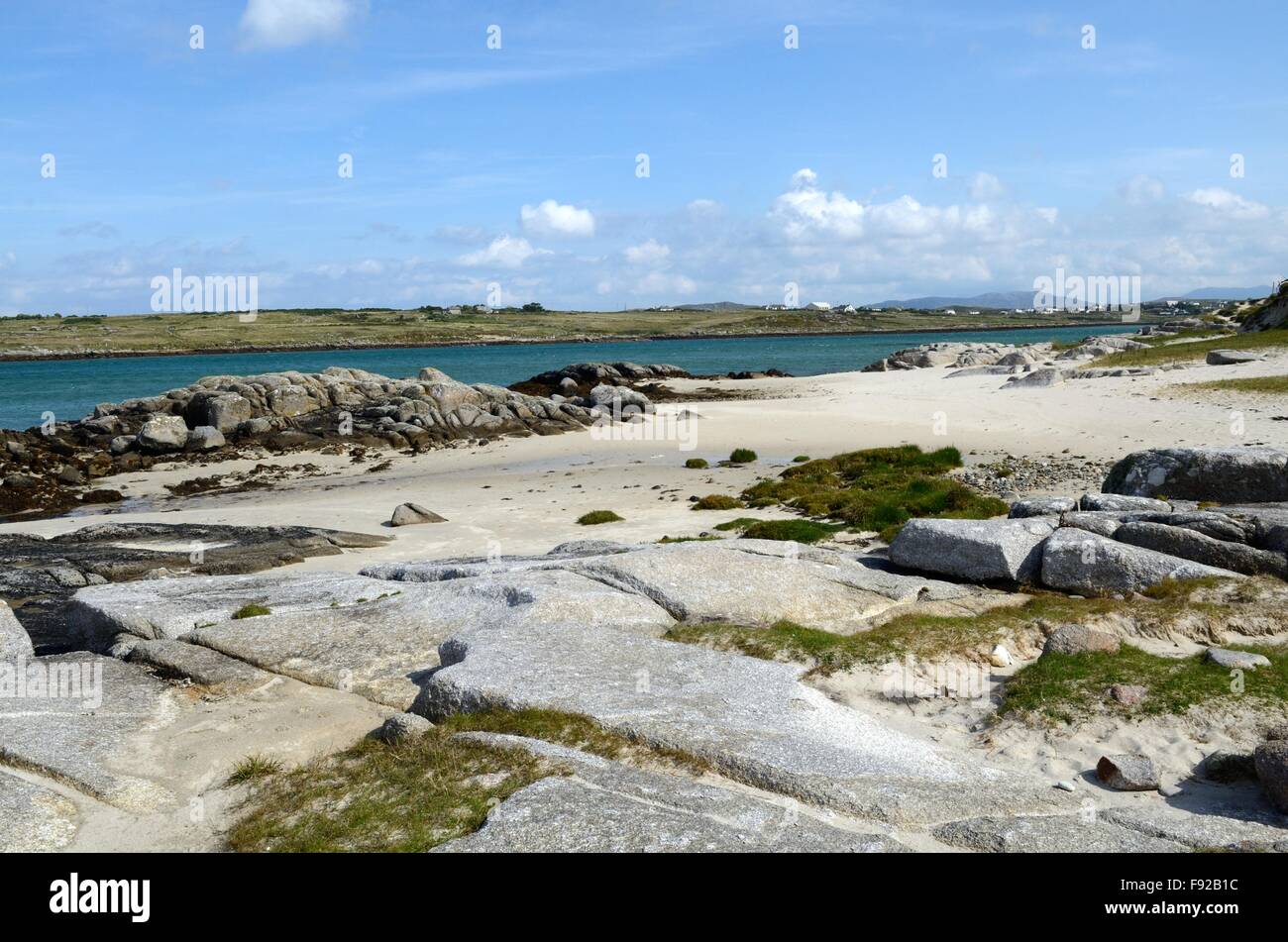 limestone platform on rugged white sand beach Omey Island Aughrus Peninsula Connemara County Galway Ireland Stock Photo