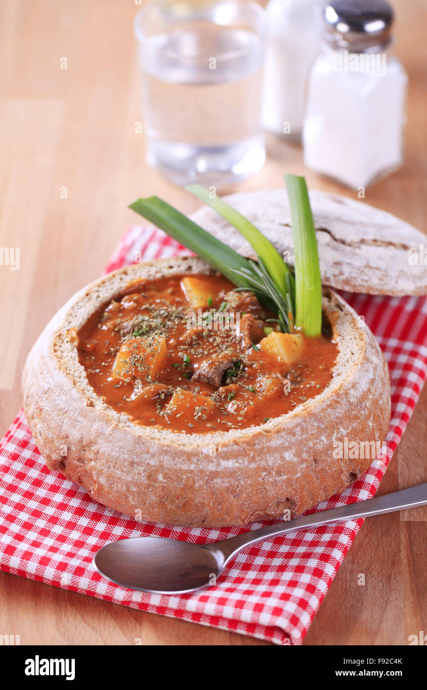 Goulash in a bread bowl Stock Photo Alamy