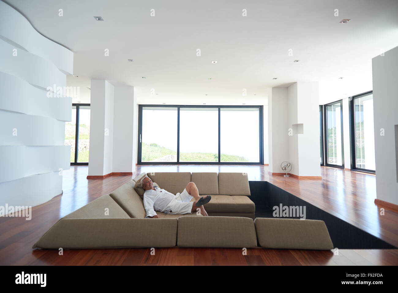 Portrait of senior man relaxing in sofa at home Stock Photo - Alamy