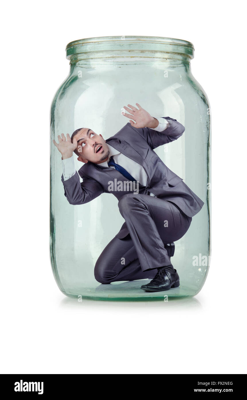 Young businessman in glass jar Stock Photo