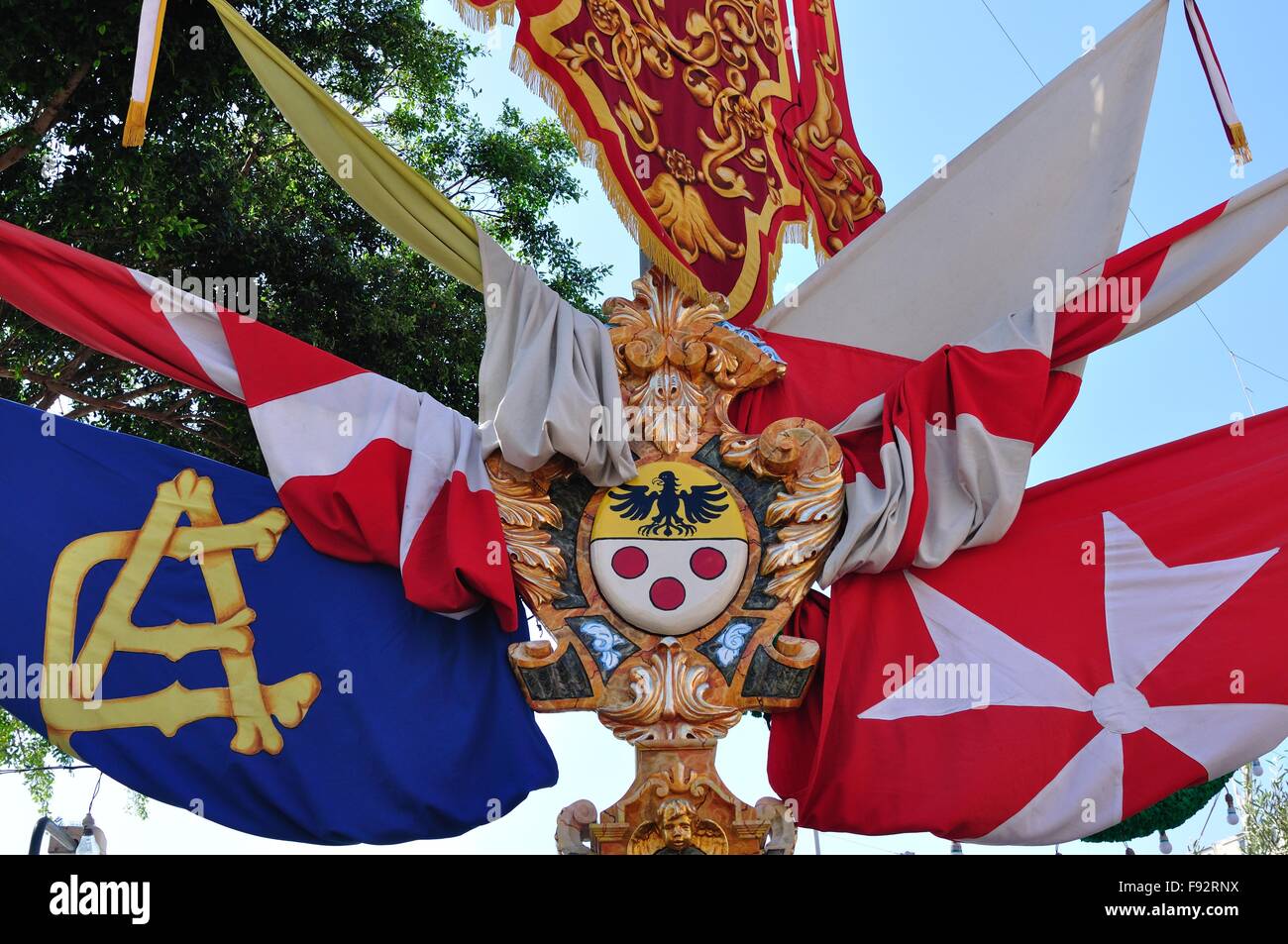 decorated Maltese lamppost, festooned with national and local flags
