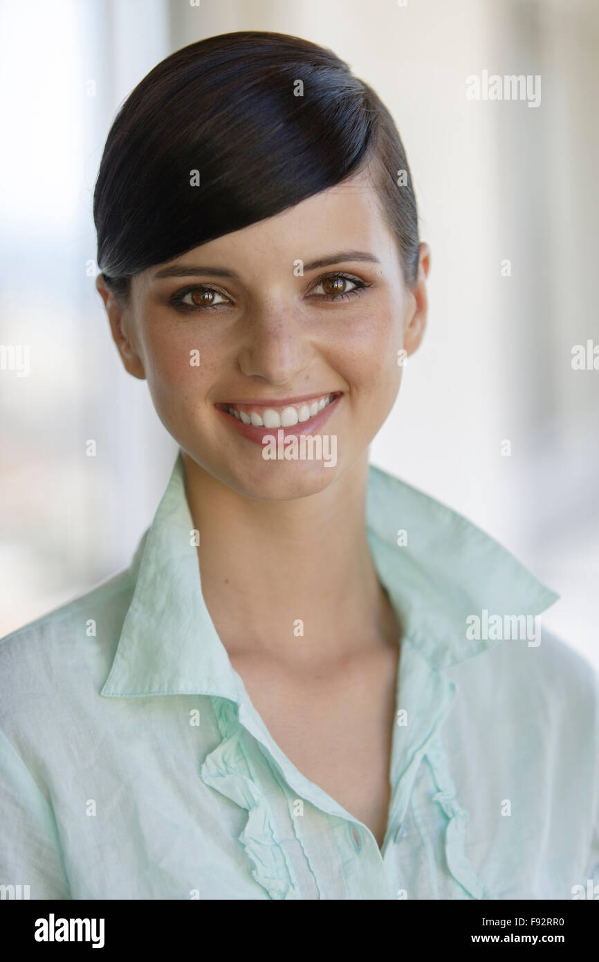 Portrait darkhaired young woman indoors Stock Photo - Alamy