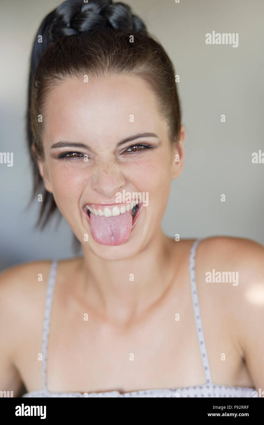 Woman sticking tongue out happy hires stock photography and images Alamy