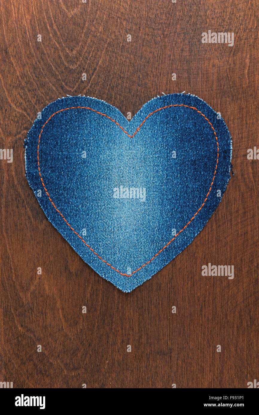 Jeans heart on wooden background, Valentine's Day Stock Photo