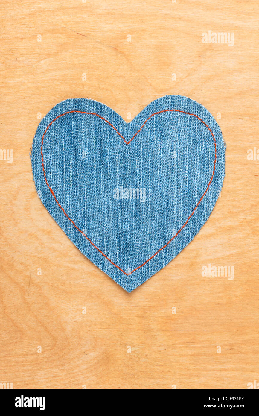 Jeans heart on wooden background, Valentine's Day Stock Photo