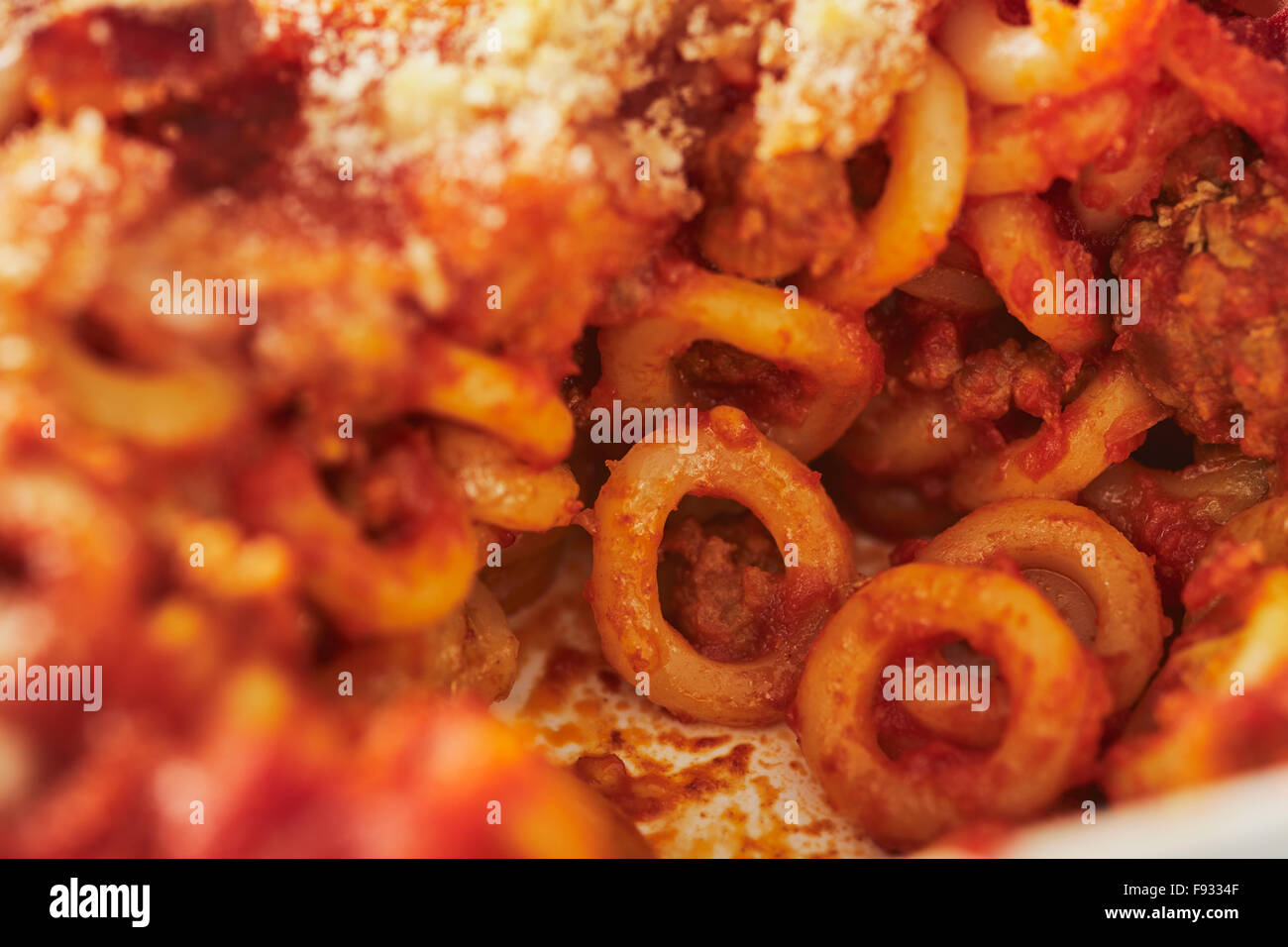 Baked anelletti pasta with mince, sauce and mozzarella. Typical