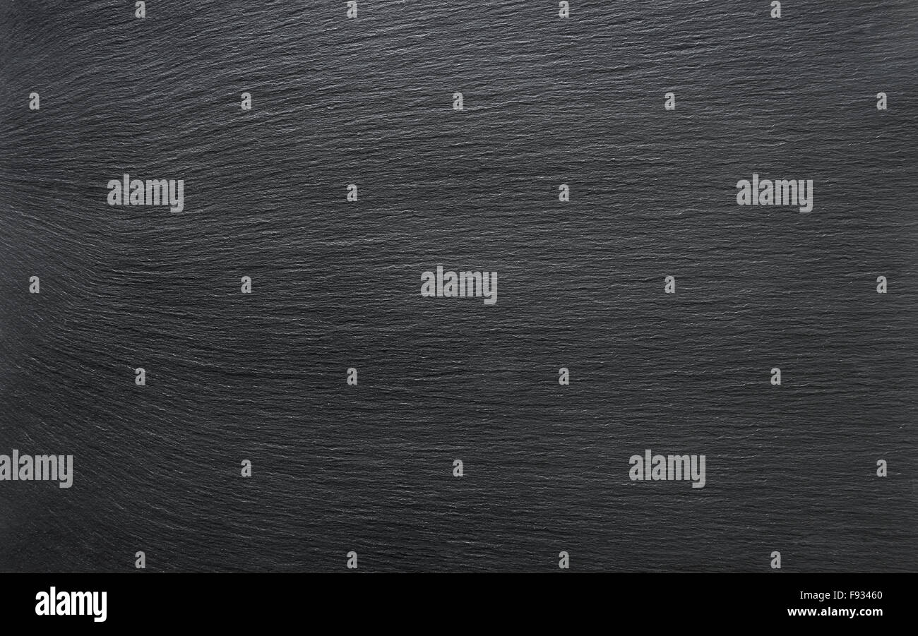Black slate background or textured stony table close-up Stock Photo