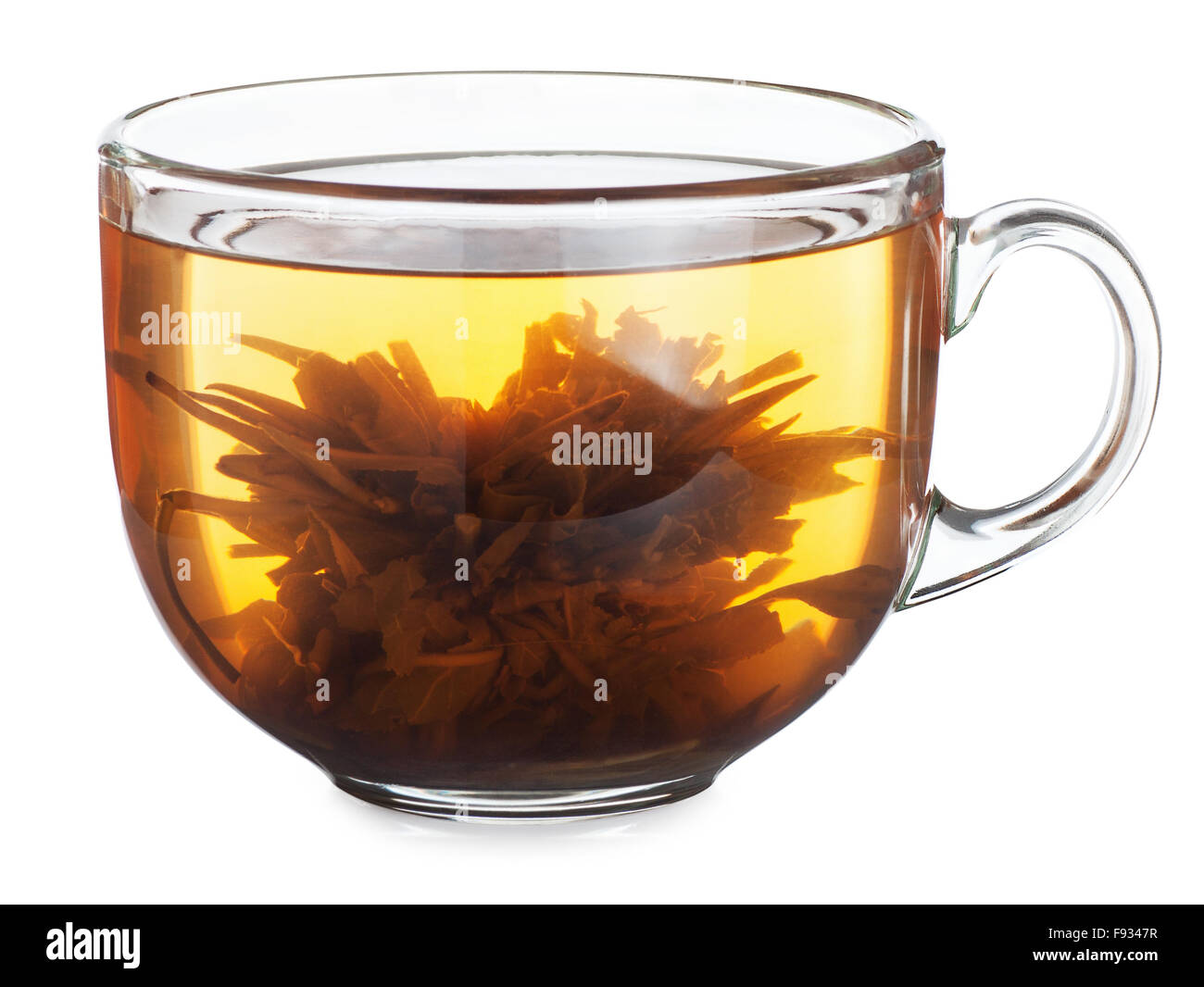 exotic blooming green tea with flower in glass cup isolated on white background Stock Photo