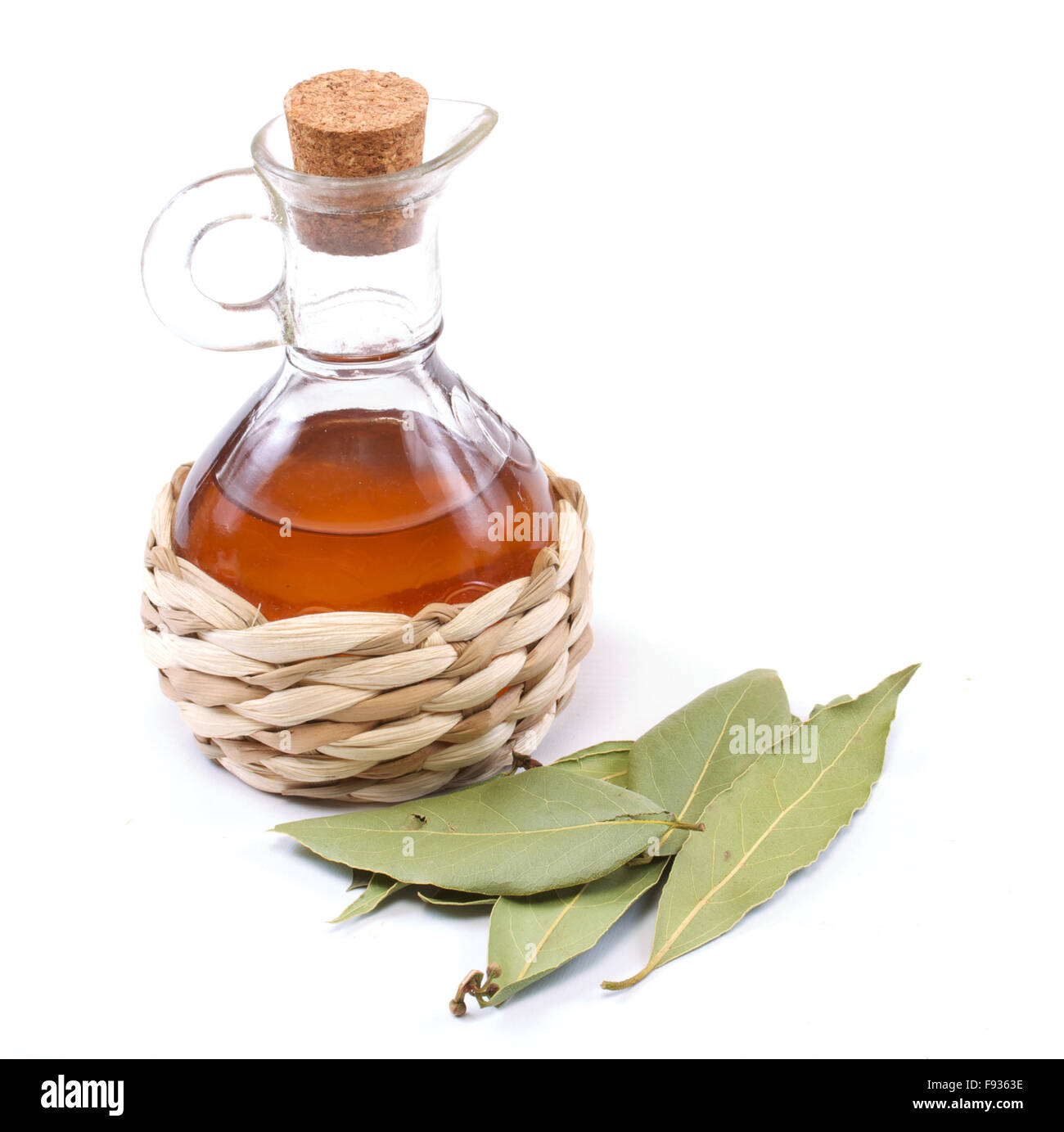 vinegar bottle and laurel leaf on the white Stock Photo Alamy