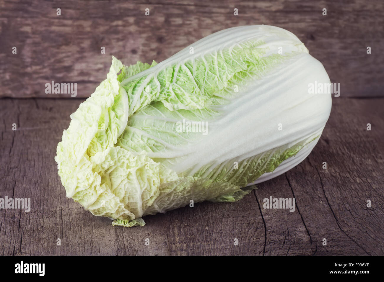 one whole fresh Chinese cabbage on old table Stock Photo