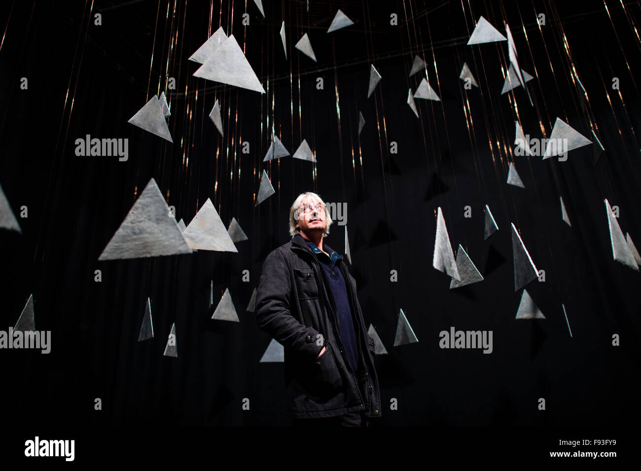 The Fractal Clock, created by artist and performer Richard Downing (pictured standing amongst the hanging slates) , at Castle Theatre Aberystwyth , consisting of 180 triangles of slate, each rotating at a different rate, all coming together to form the complete pattern, viewable from a fixed point in the auditorium,  once every hour. Stock Photo