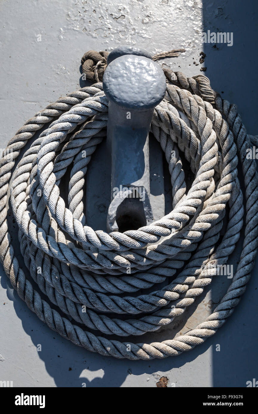 Nautical Rope Column Close up detailed top view of grey nautical rope at an open deck of a ...