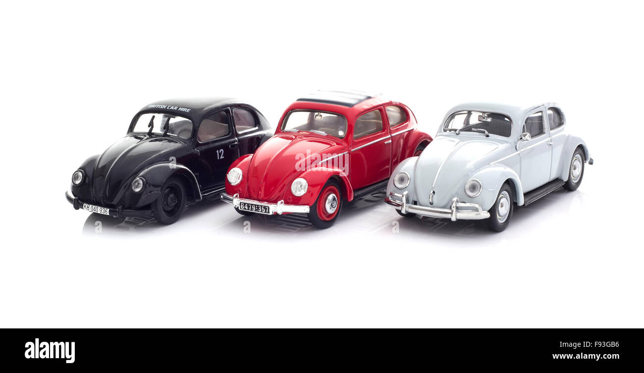 Three Vintage VW Beetles Die cast models on a white background. Stock Photo