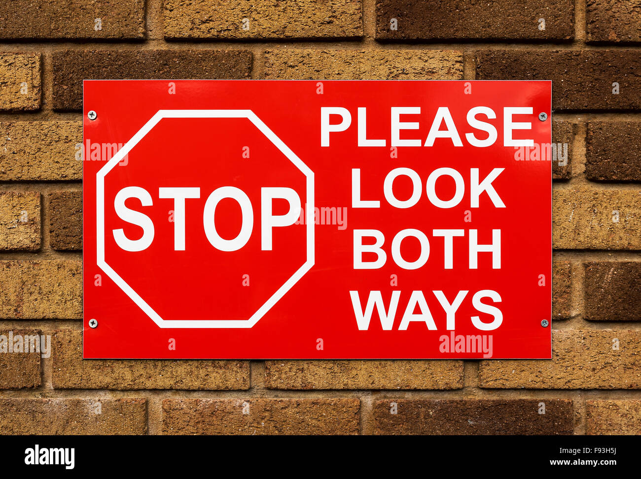 Caution sign on the wall Stock Photo Alamy