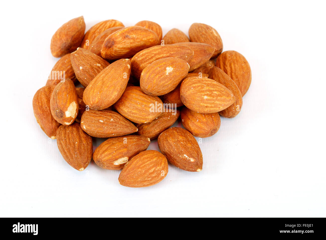 Almond macro isolated in white background Stock Photo - Alamy