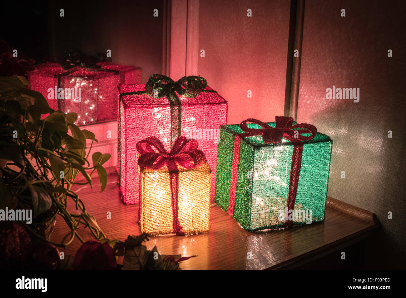 Three lighted christmas gift boxes hires stock photography and images